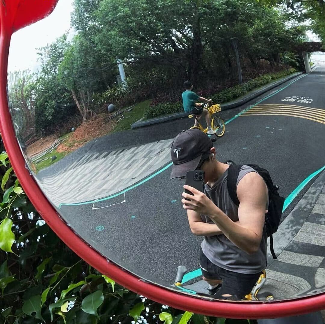 Nick on a morning ride, caught in a traffic mirror